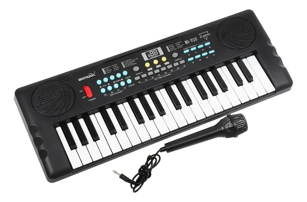 Teclado órgano musical infantil a pila con micrófono